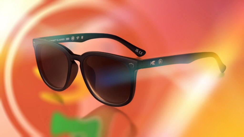 DuckDuckGo’s Anti-AI Sunglasses Won’t Spy On Anyone DuckDuckGo black sunglasses on a swirled orange background