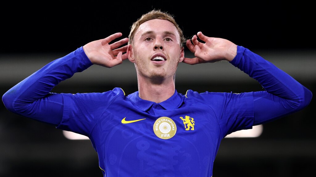 Chelsea forward COle Palmer celebrating - lifting both hands to his ears.