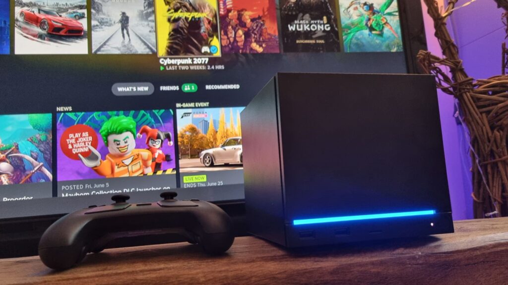 Steam Week in Review: Once positioned as mainstream-friendly PC gaming solutions, can Valve’s hardware survive the memory crisis? A Steam Machine in front of a TV next to a Steam Controller, showing the SteamOS in the background