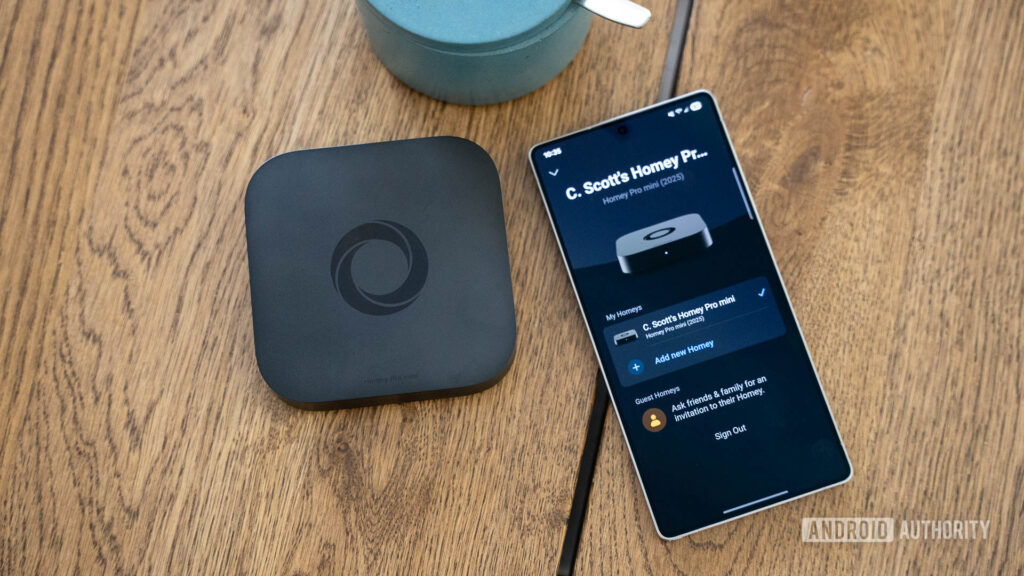 Your Homey app is getting a lot more powerful Homey Pro Mini device next to phone with Homey app on display