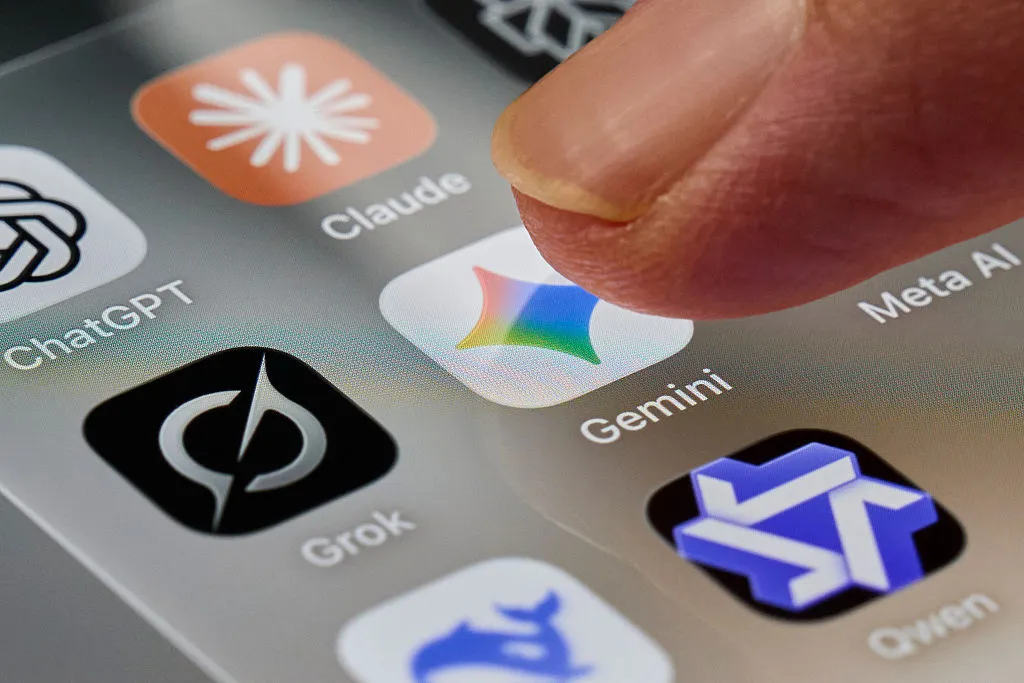 Google’s AI Wants to Call Stores for You — Here Are the Problems With That A finger taps the Gemini app icon on a smartphone screen.