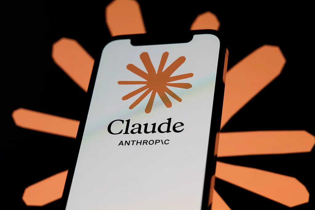Have You Protested AI Recently? Anthropic May Be Watching You for Precrimes Phone showing Claude AI logo.