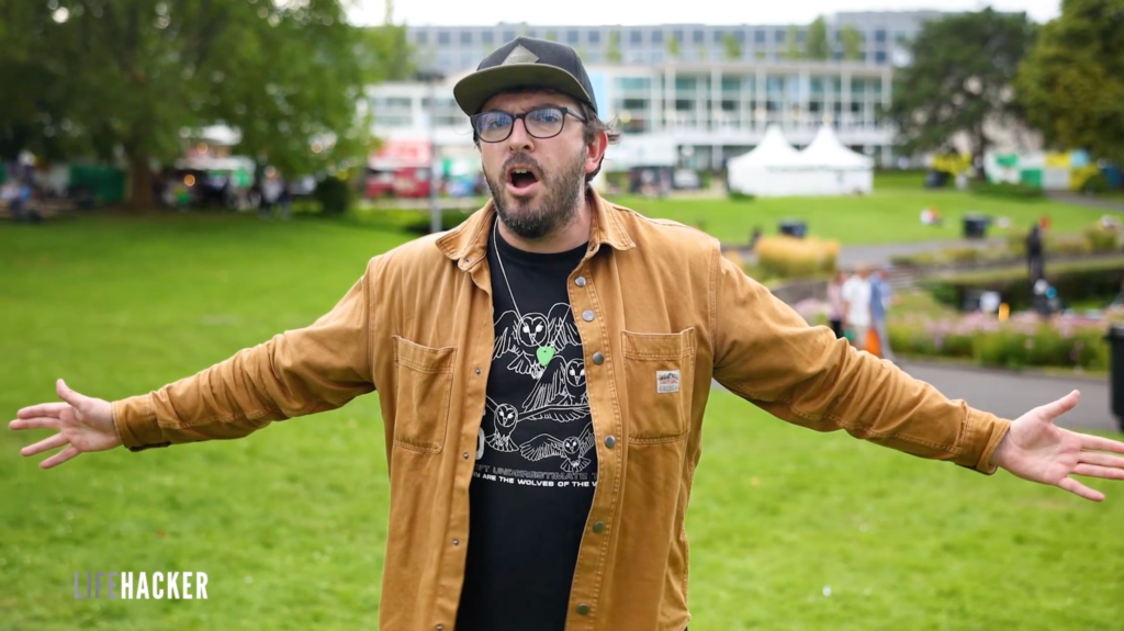 The writer holding his arms wide open in a welcoming gesture