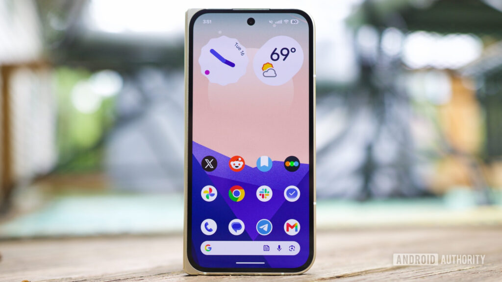 A Pixel running Android 17, showing the home screen with hidden app icon names.