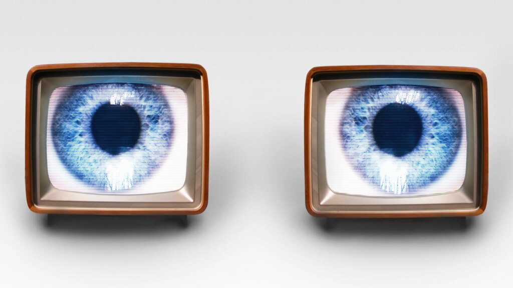 Is Your TV Spying on You? Yes, and Here’s How to Fix It Two old fashioned TV sets with blue eyes in each, set up to look like eyes looking out