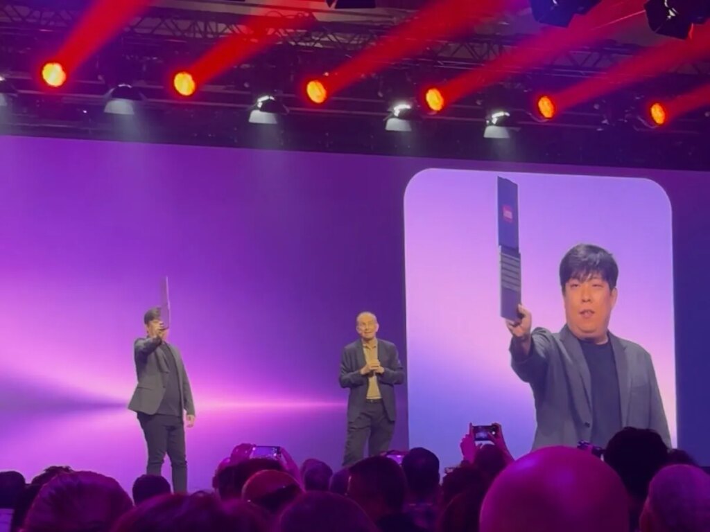 The Coolest Thing I Saw at IFA 2026: The Coolest, Quietest, Thinnest Laptop Concept Presenter on stage holds up an open Lenovo Project AeroBlade laptop vertically to show off how thin it is.
