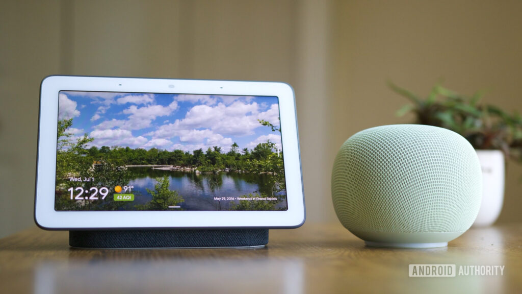 Google Home can once again change smart light colors for you Google Nest Hub and Google Home Speaker sitting next to each other.