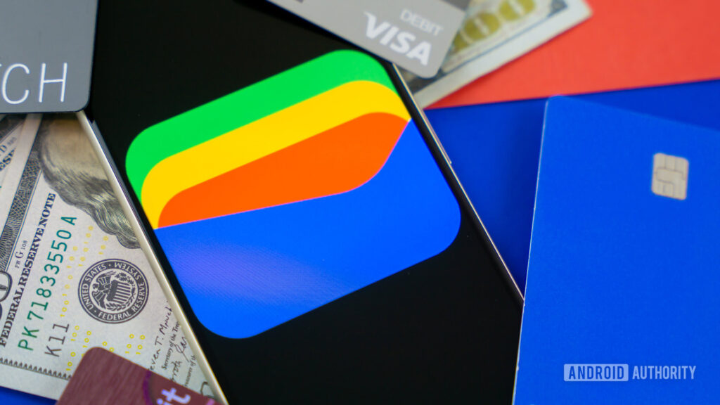 Google Wallet’s Apple-inspired card redesign is rolling out widely Google Wallet logo on smartphone next to credit cards and cash Stock photo 8