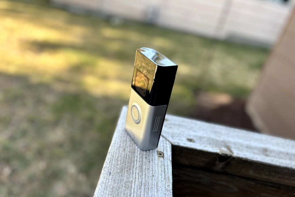 I Test Home Security Tech. Here Are 4 Devices I Rely on to Guard My Porch A Ring video doorbell on a porch fence.
