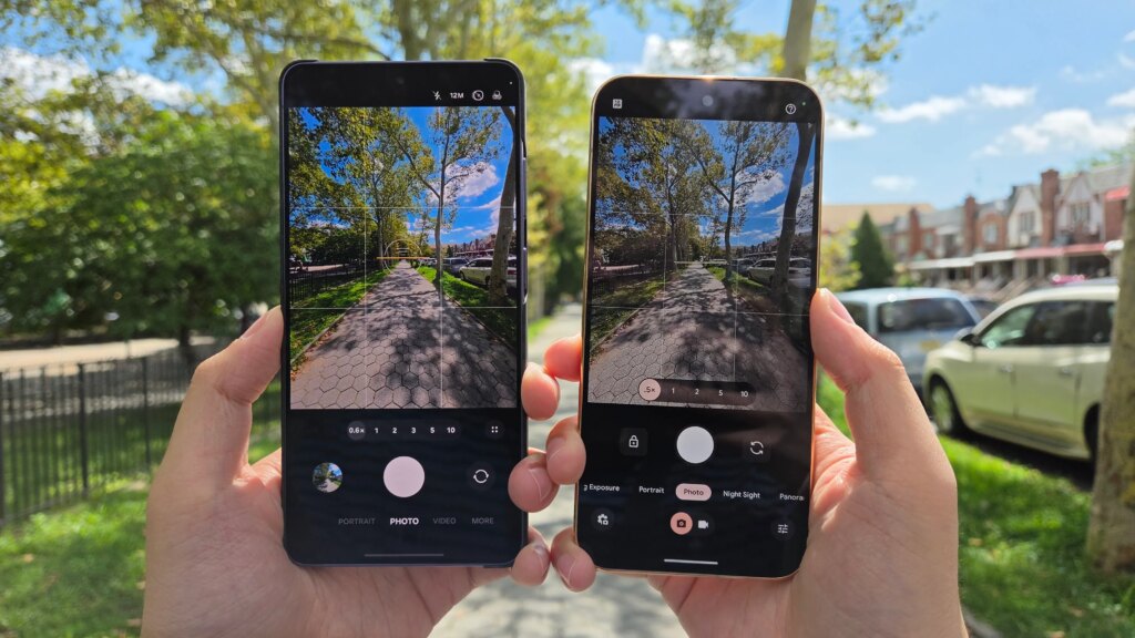 Two phone cameras pointed at a sidewalk.