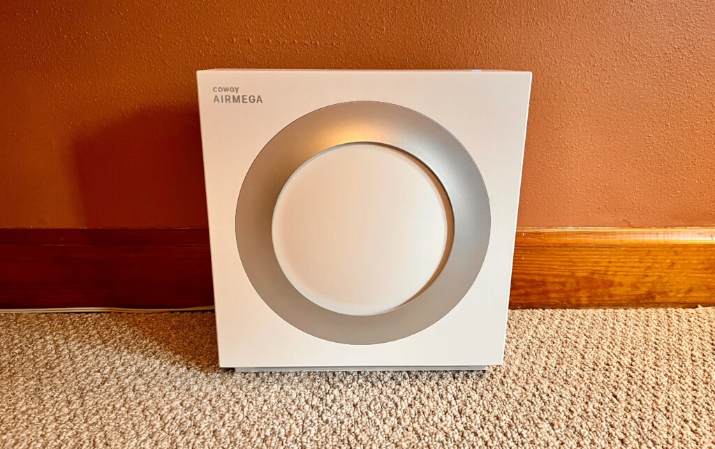 Our Favorite Air Purifier Brand Just Released a Smaller, More Affordable Option A white square air purifier sitting on a floor