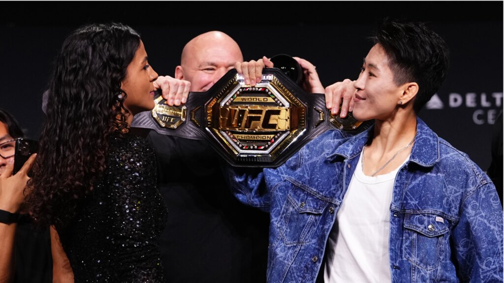 Opponents Natalia Silva and Wang Cong face off during the UFC 332 press conference.